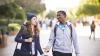 Two students walking outside and chatting